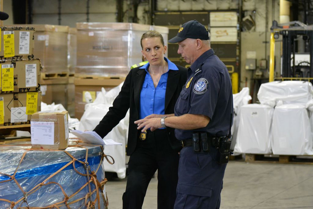 HSI officers discussing a case
