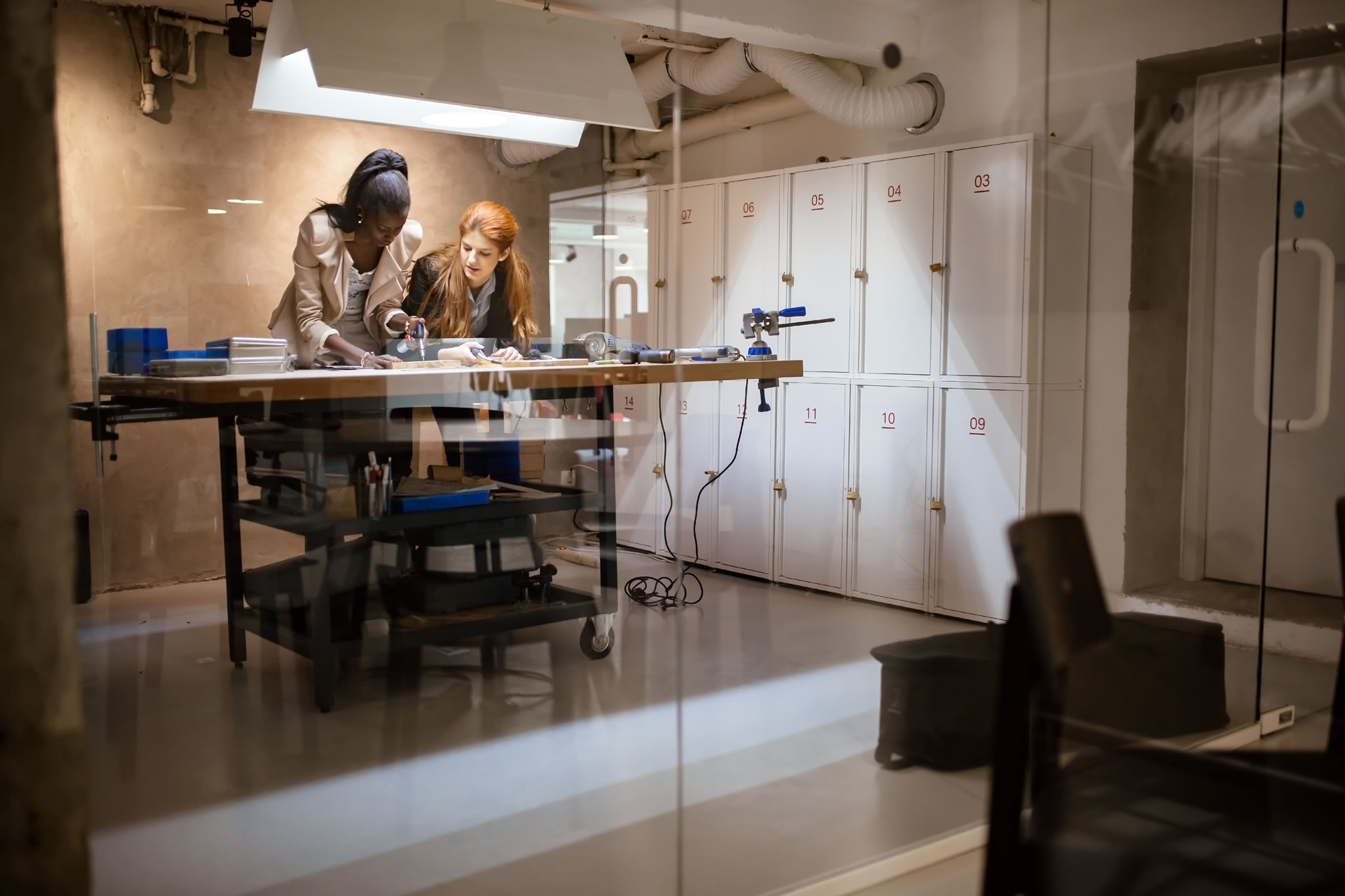people working in modern beautiful workshop